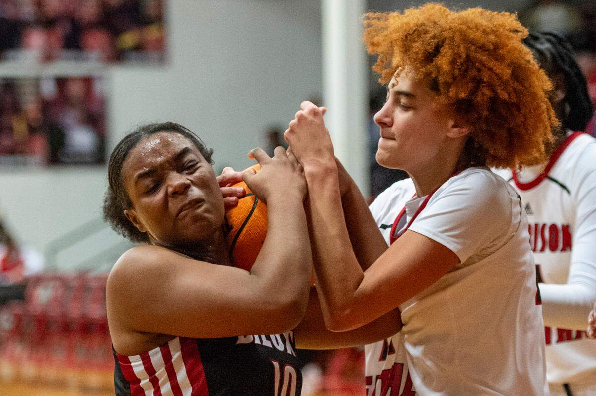 Biloxi’s Aubrey Hill and Harrison Central’s Larissa Hubbard fight for possession of the ball during a game against Harrison Central at Harrison Central High School in Harrison County on Tuesday, Dec. 12, 2023.