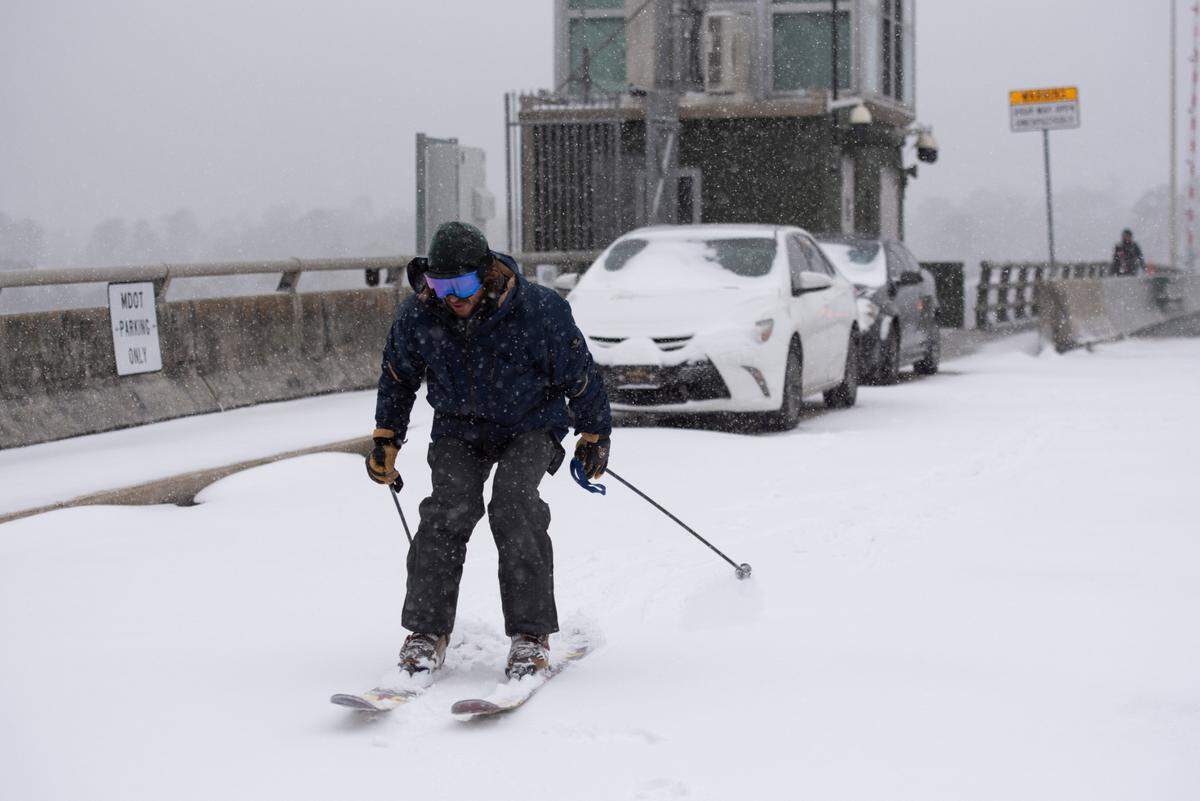 Clint Herring prepares to ski down the Fort Bayou Bridge during a winter storm on the Mississippi Coast on Tuesday, Jan. 21, 2025.
