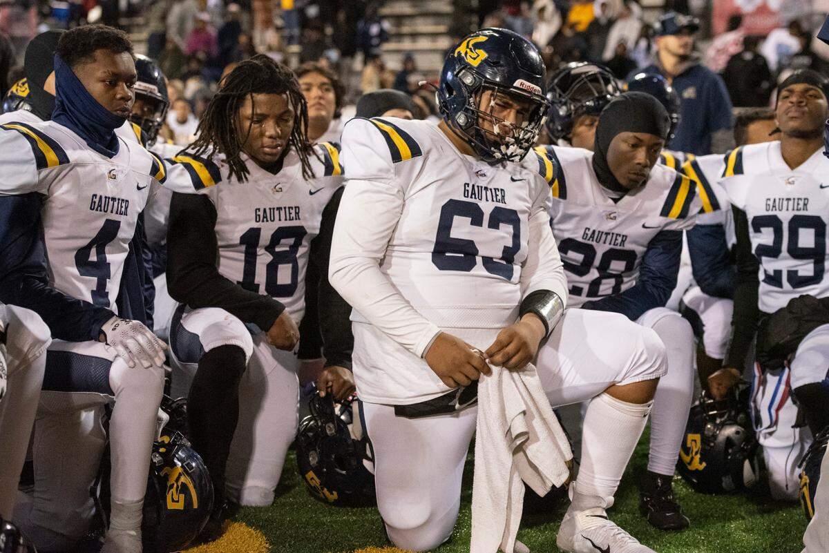 Gautier players react after Gautier lost the MSHAA Class 5A Football Championship at M.M. Roberts Stadium in Hattiesburg on Friday, Dec. 6, 2024.