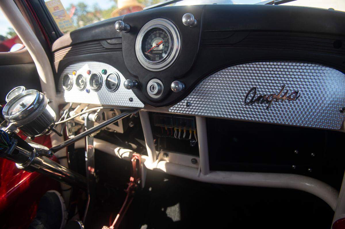 The interior of Martin Bishop’s 1952 Ford Anglia during View the Cruise at Cruisin’ The Coast in Gulfport on Sunday, Oct. 6, 2024. When Bishop restored the car, he put the steering wheel on the left like American cars, despite most British cars having the steering wheel on the right.