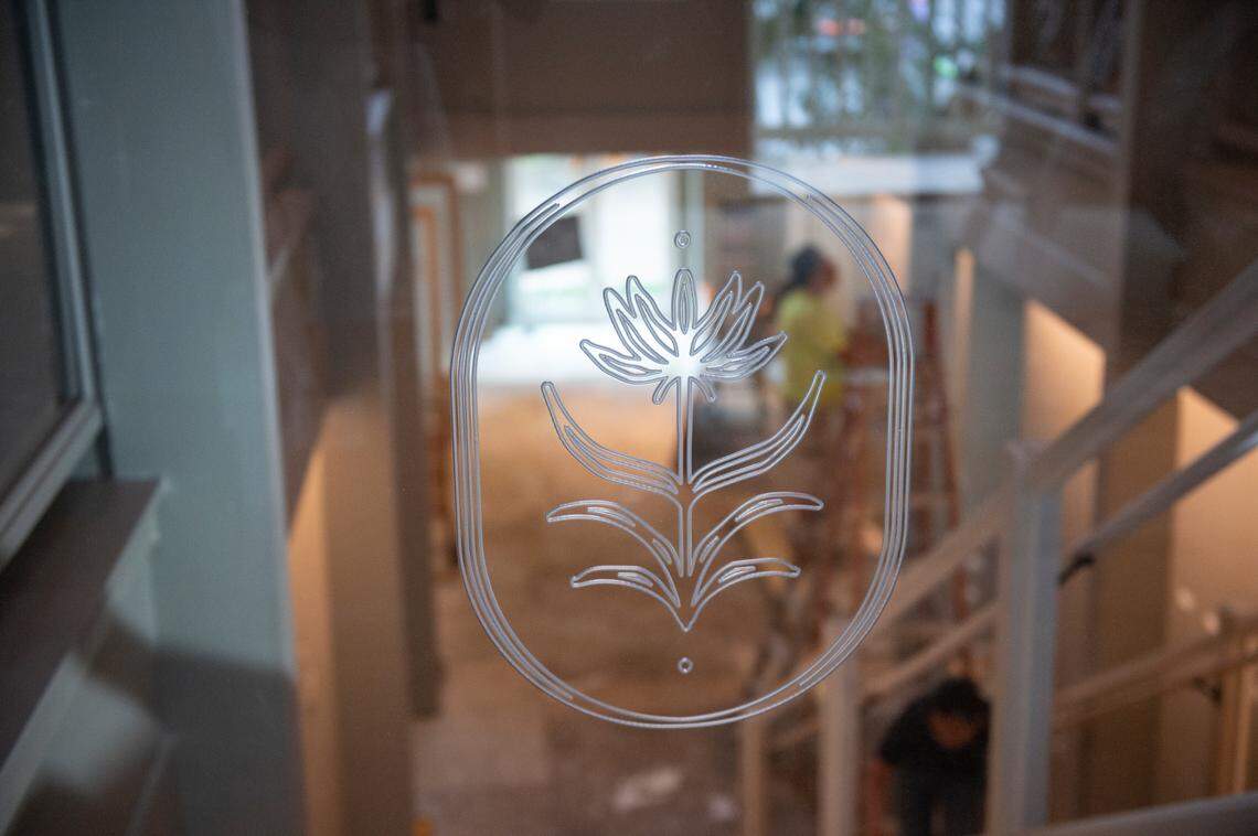 The logo of The Springs Hotel is displayed on the banister inside the boutique hotel as it is under construction in Ocean Springs.