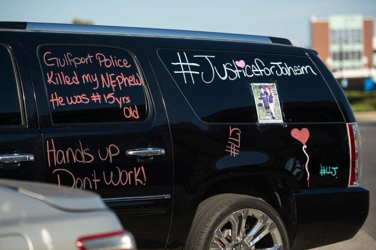 A car covered with messages in support of Jaheim McMillan, who was shot by police, during a protest outside the Gulfport Police Station in Gulfport on Tuesday, Oct. 11, 2022.