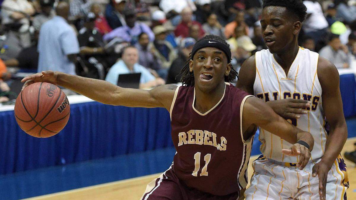 CHRIS TODD/SPECIAL TO THE SUNHERALD 
 George County's Tyrese Fryfogle (3) dribbles past Columbus defender T.J. Gray on Saturday, March 5, 2016, in the MHSAA state basketball tournament quarterfinals at the Mississippi Coliseum in Jackson, Miss.