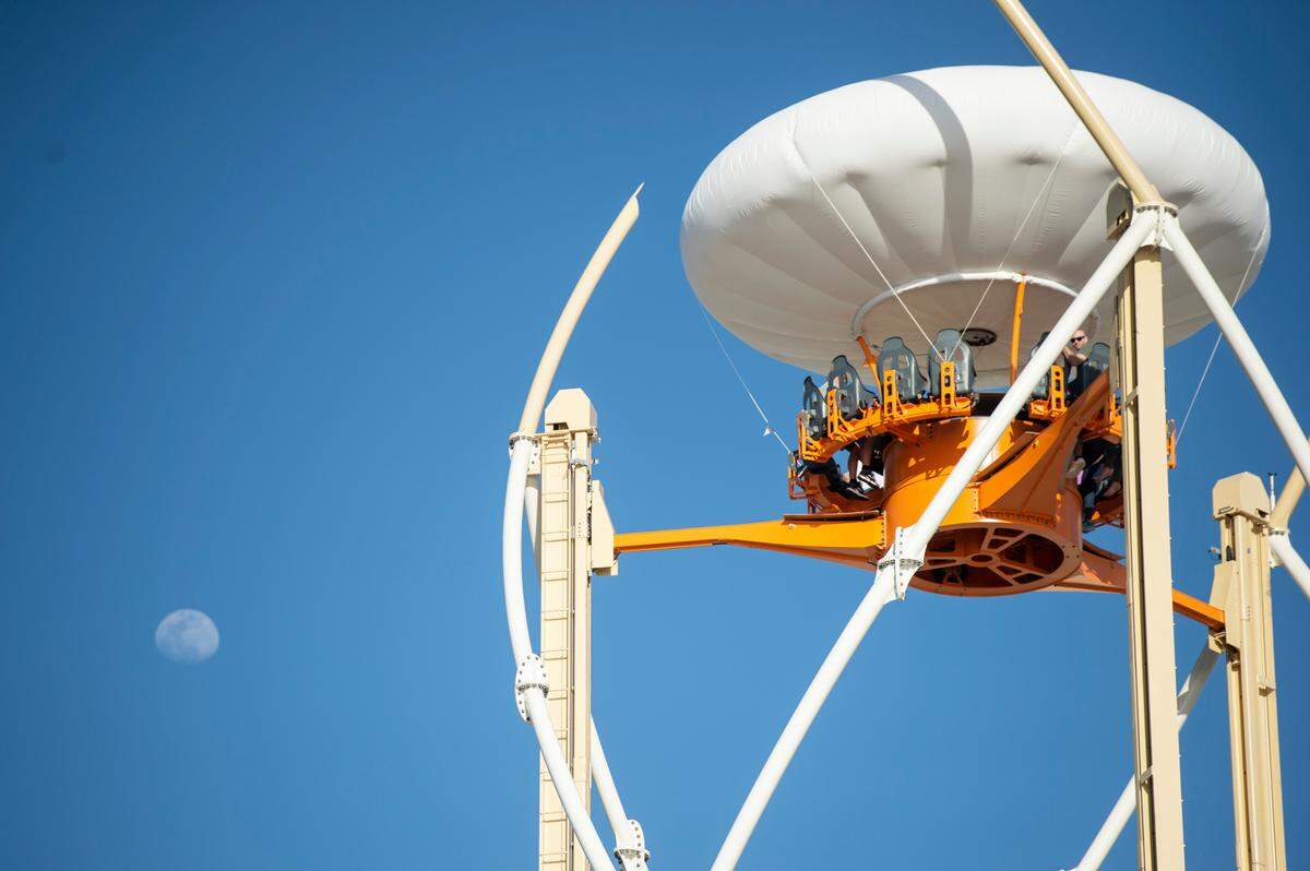 Park guests ride the Aerobar during the grand opening of Paradise Pier amusement park at Margaritaville in Biloxi on Friday, March 3, 2023.
