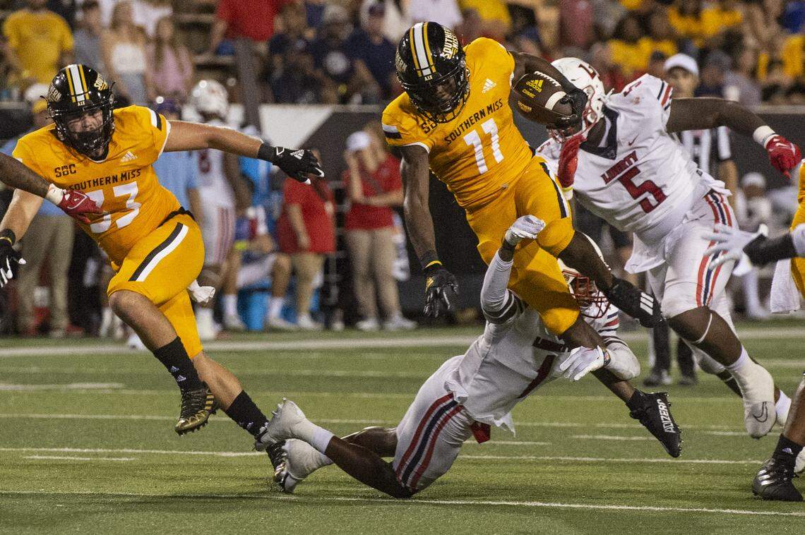 Southern Mississippi offensive lineman John Bolding (77) gets tackled by Liberty during a NCAA college football game in Hattiesburg, Miss., Saturday, Sept. 3, 2022. Southern Mississippi lost 29-27