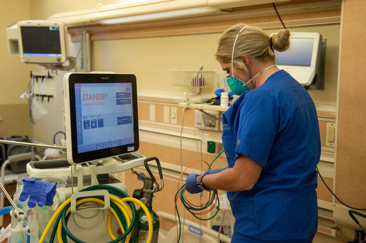 A nurse sets up a ventilator in preparation for a patient inside the ICU at Singing River Health System hospital in Ocean Springs on Tuesday, July 27, 2021.