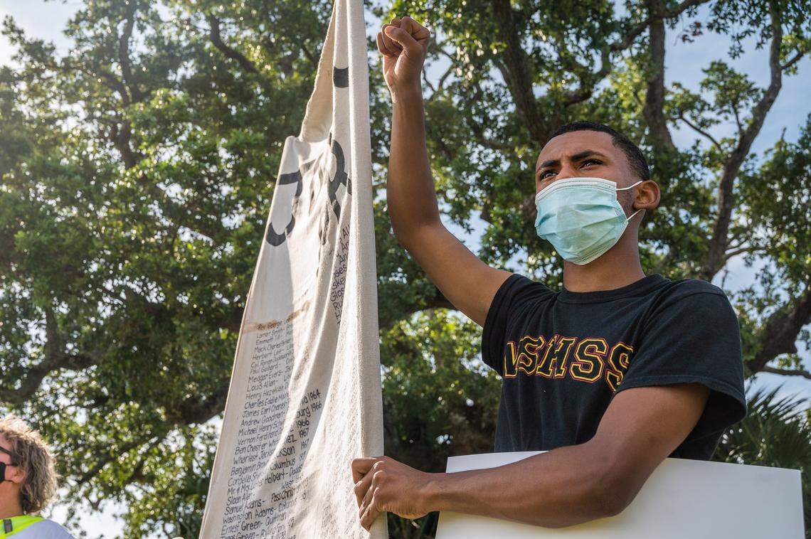 Charles James Mclean holds a sign demanding justice for Mississippi African Americans killed by the police during a protest against police brutality on Sunday, May 31st, 2020. The protest, initiated by the Mississippi Rising Coalition and the Jackson County NAACP, lined the sidewalk of Beach Boulevard across from the Biloxi Lighthouse and was one of hundreds across the country spurred by the death of George Floyd.