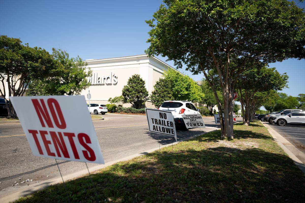 Signs are placed outside Edgewater Mall for Black Spring Break.