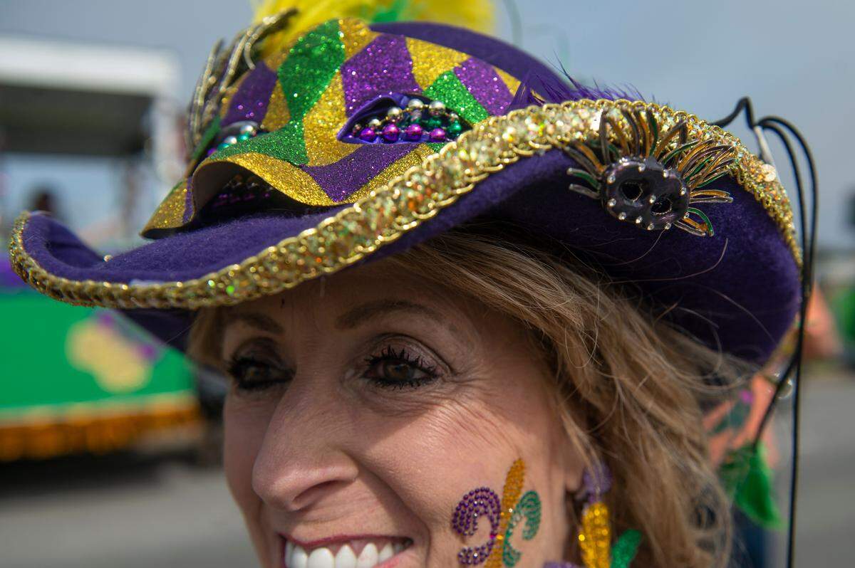 Kathy Cipolla, of Biloxi, wears a hat she made herself before the Gulf Coast Carnival Association parade in Biloxi on Tuesday, Feb. 21, 2023.