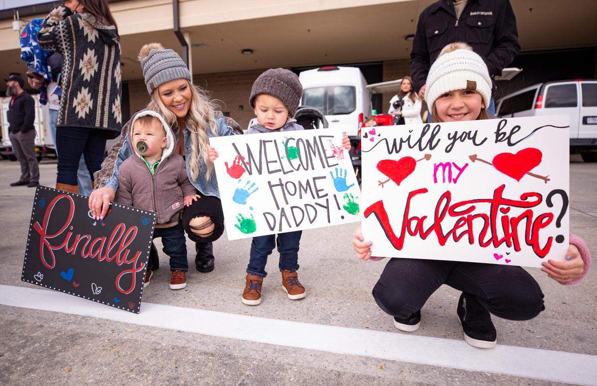 Family members and loved ones are reunited with their reserve citizen airmen as they return to Keesler Air Force Base in Biloxi, Mississippi, Saturday, Feb. 13, 2021. The airmen from the 815th Airlift Squadron and maintenance and support personnel from throughout the 403rd Wing were deployed to Southwest Asia in October 2020. 