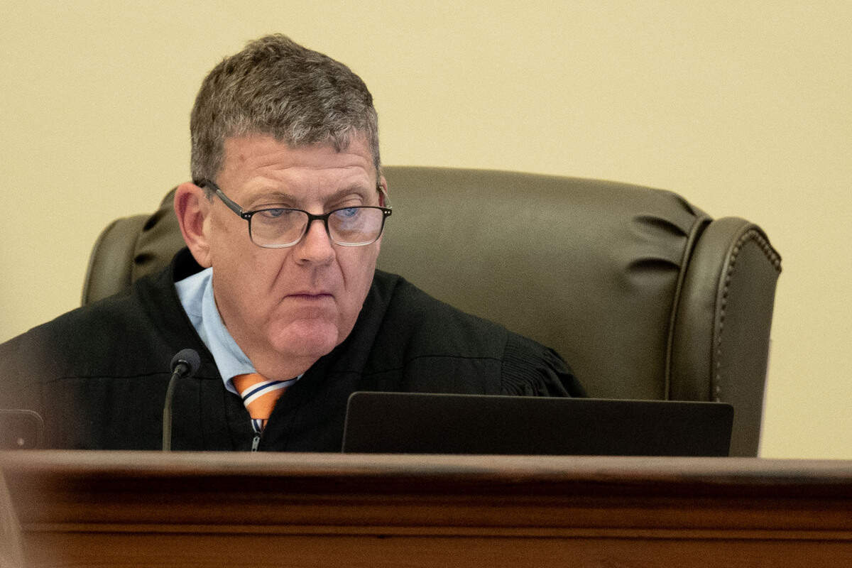 Judge Christopher Schmidt looks at his monitor during a trial for Philip and Alan Moran at Hancock County Circuit Court on Friday, June 12, 2026.