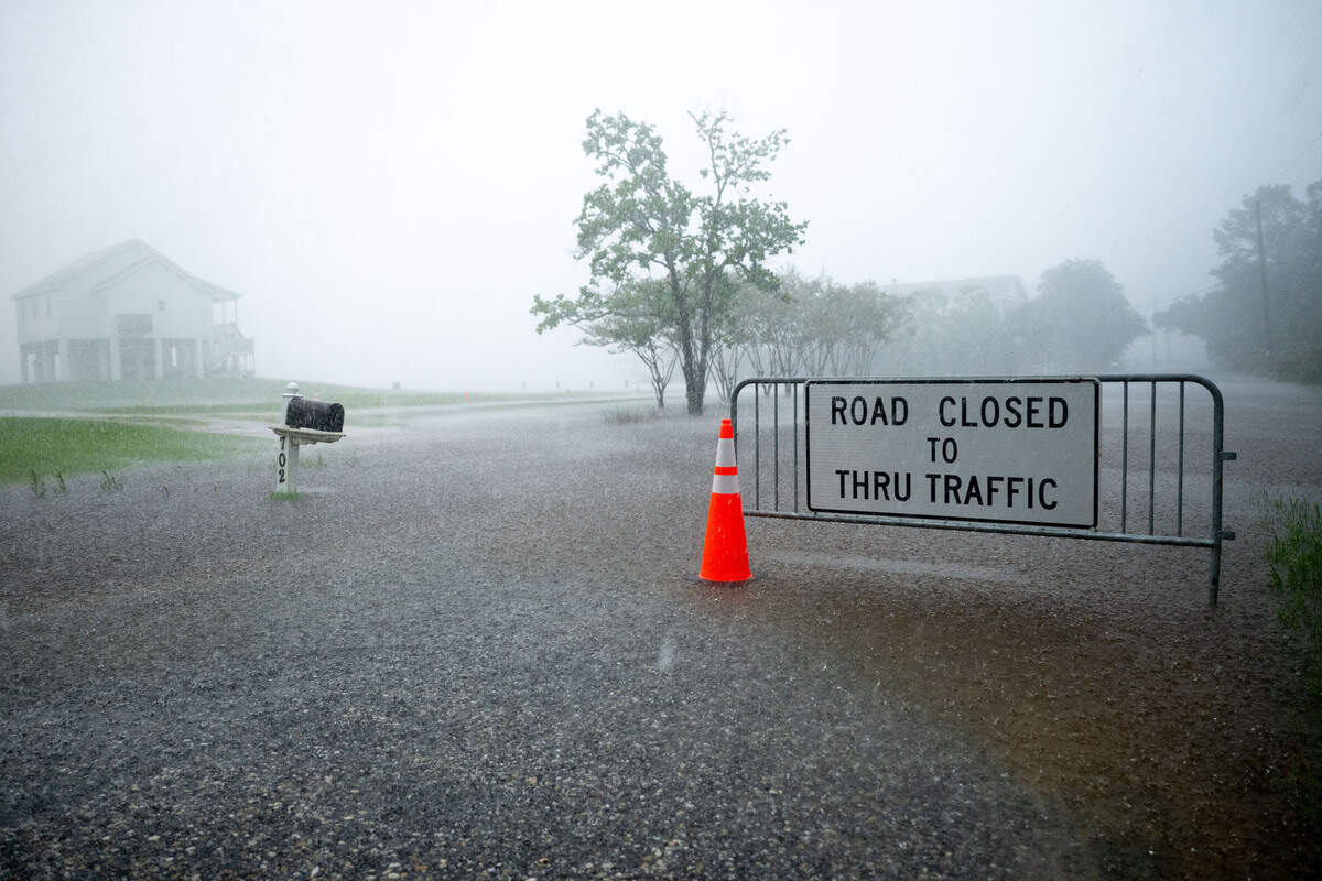 The entrance to a neighborhood on Clark Avenue in Pass Christian is closed off due to flooding during a rainstorm on Thursday, June 18, 2026.
