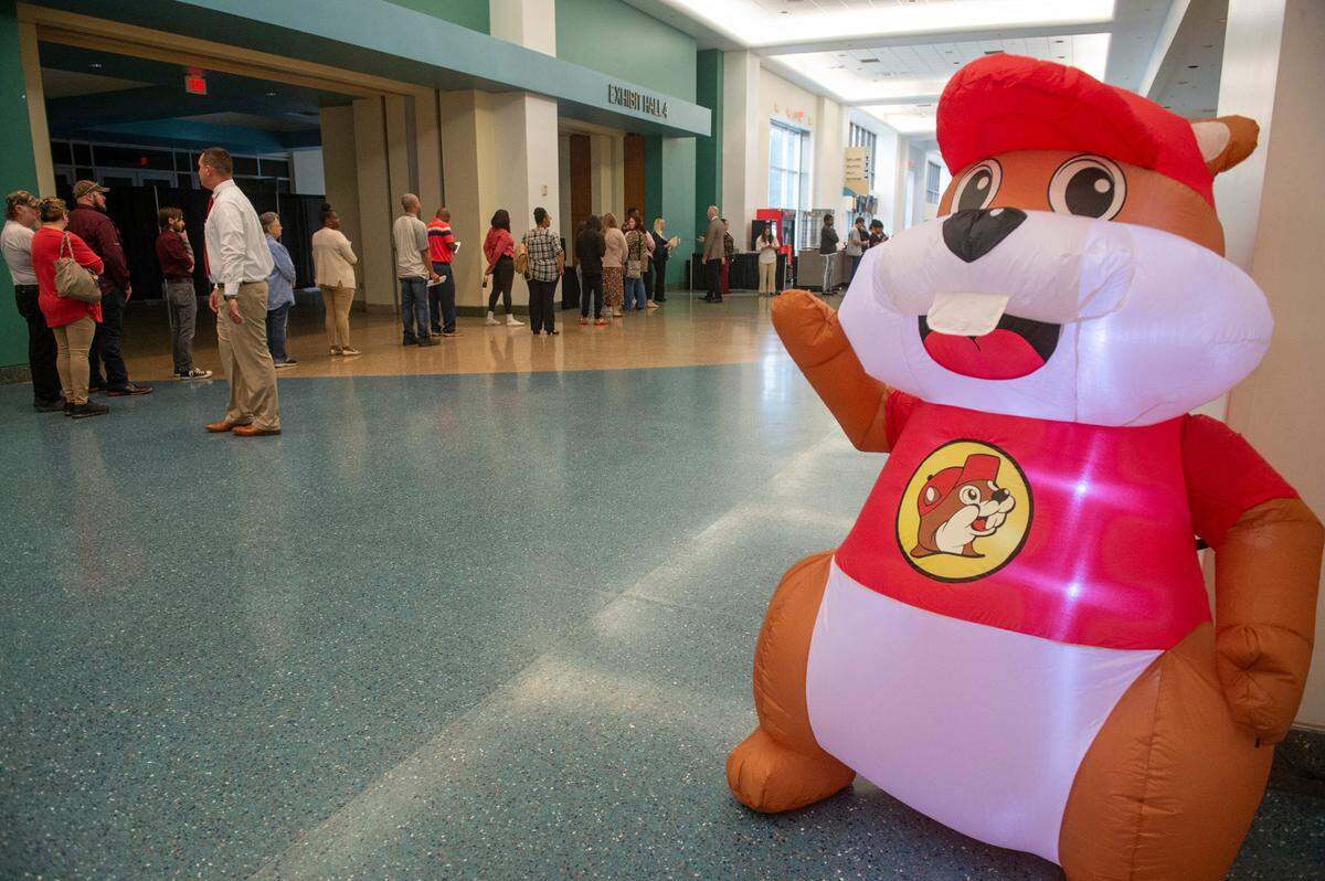 Job applicants wait in line for a job fair at the Mississippi Coast Coliseum for the new Buc-ee’s in Pass Christian on Wednesday, April 2, 2025.