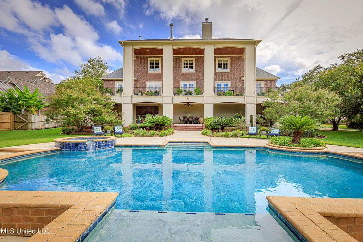 A balcony overlooks 609 Rue Dauphine’s pool and backyard.