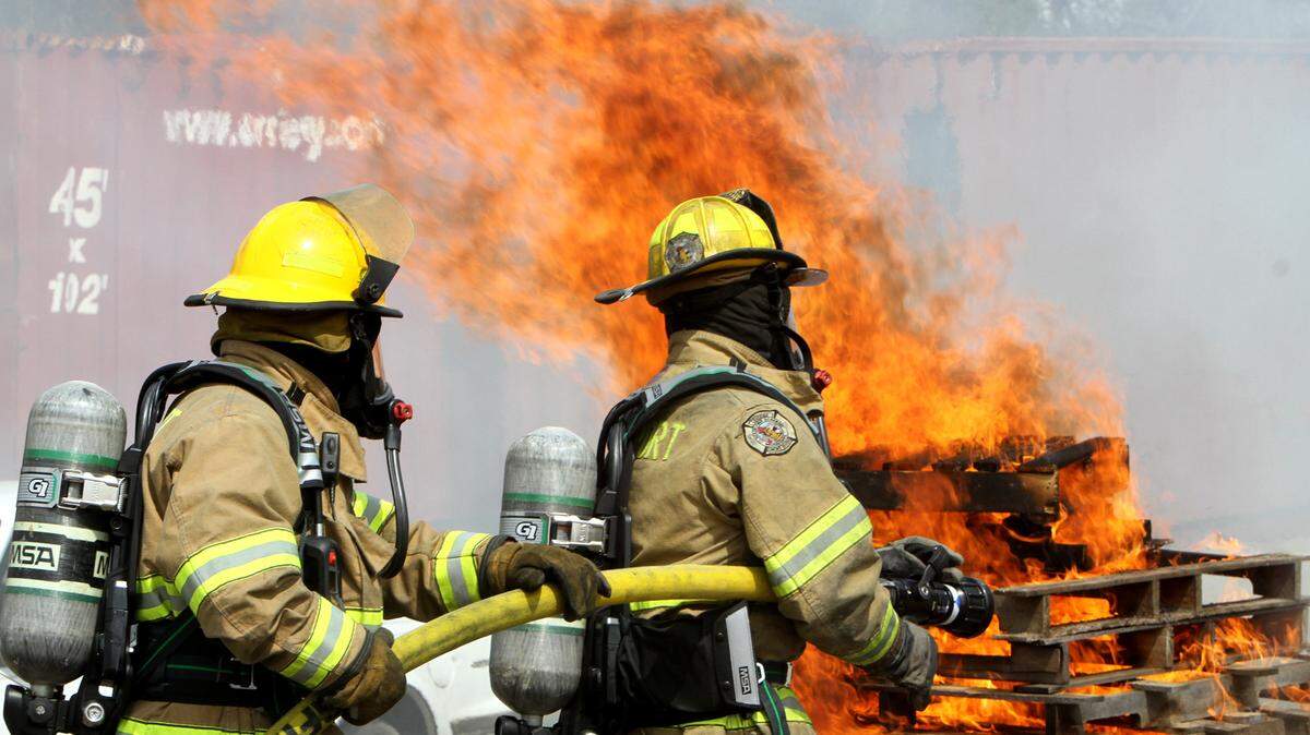 TIM ISBELL/SUN HERALDGulfport firemen Bill Dubuisson and Mickey Sheppard prepare to put out a fire using the F-500 Encapsulator Agent, Wednesday, March 16, 2016. The encapsulator has the ability to cool a fire and surrounding structures, with the ability to absorb 6-10 times more heat energy than plain water.