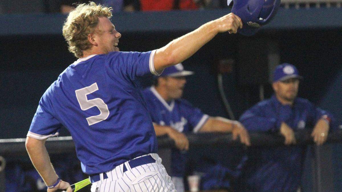 JOHN FITZHUGH/SUN HERALD
Ocean Springs' Taylor Reeves salutes teammate Britt McKay after his two-run double drove him in during the first inning of their game against Gulfport at MGM Park in Biloxi on March 17. Reeves had three hits in Ocean Springs' 15-4 victory at D'Iberville on Friday.