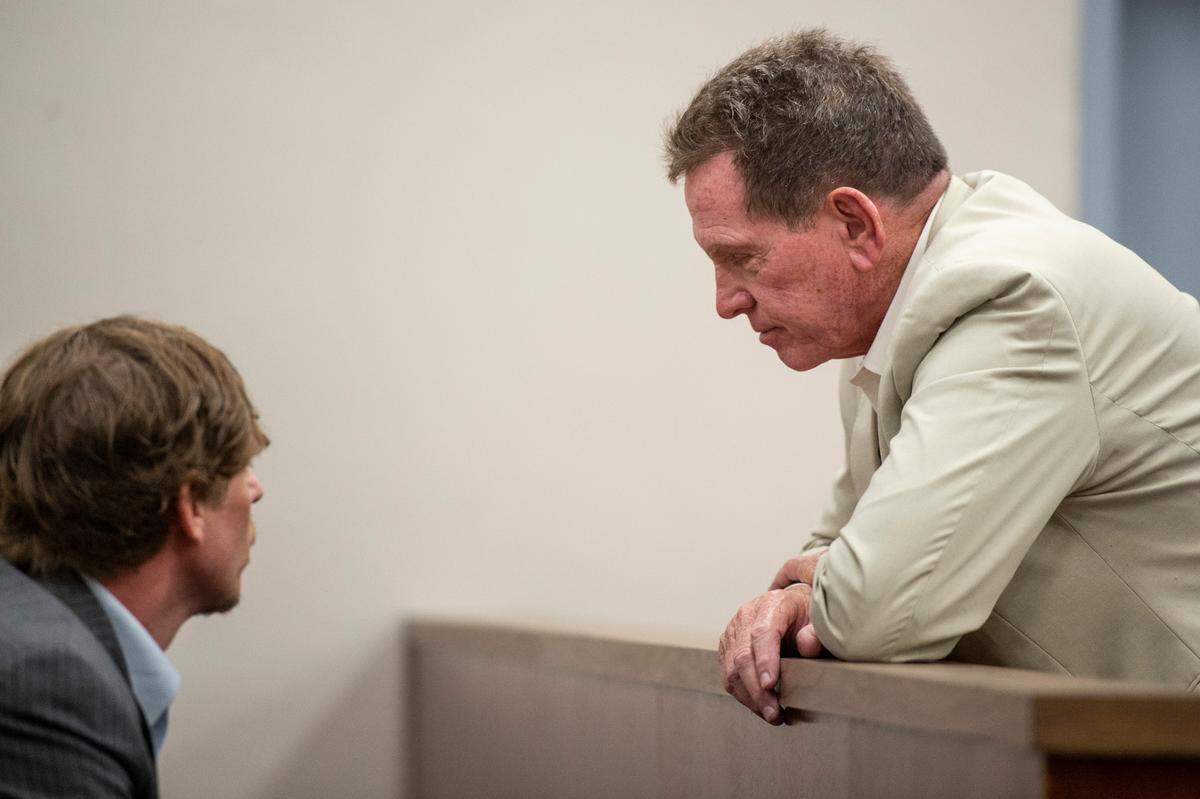 Cliff Kirkland talks with family members before the start of his trial for sexual assault at Harrison County Circuit Court in Biloxi on Thursday, May 12, 2022.