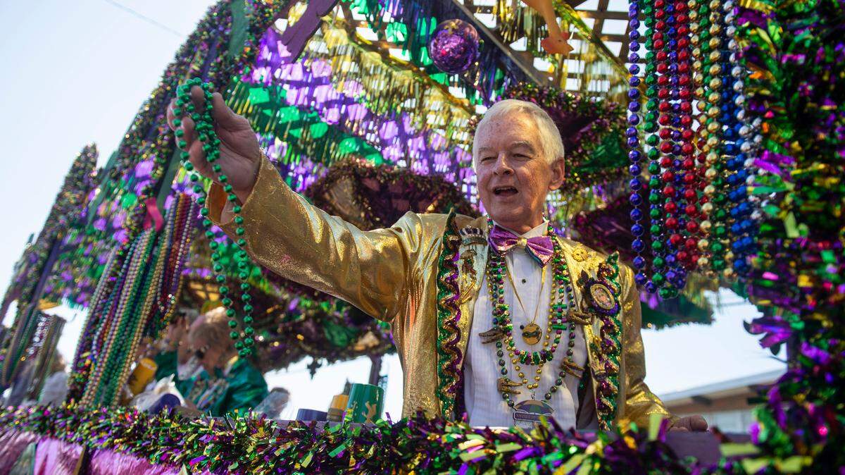 Krewes toss beads and other throws during the Jackson County Carnival Association Mardi Gras parade in Pascagoula on Saturday, March 1, 2025.