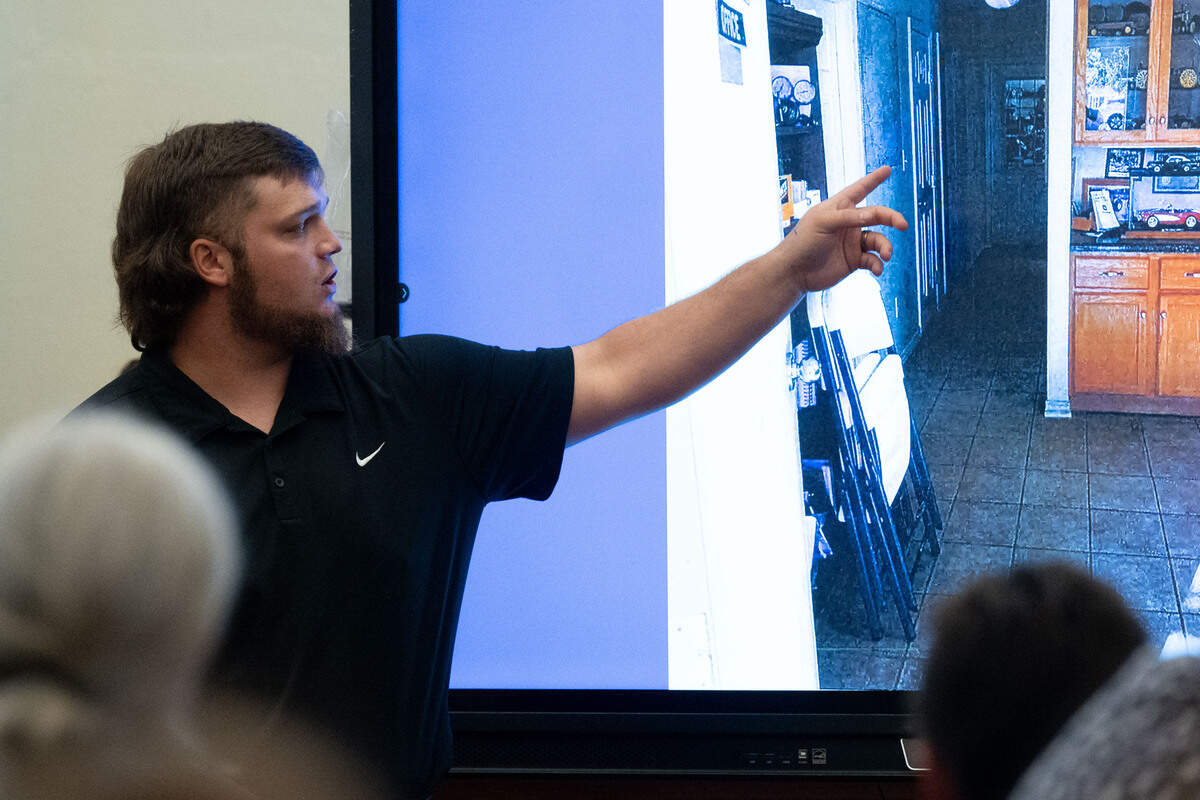 Jeremy Billings points to a picture of the Moran’s office during a trial for Philip and Alan Moran at Hancock County Circuit Court.