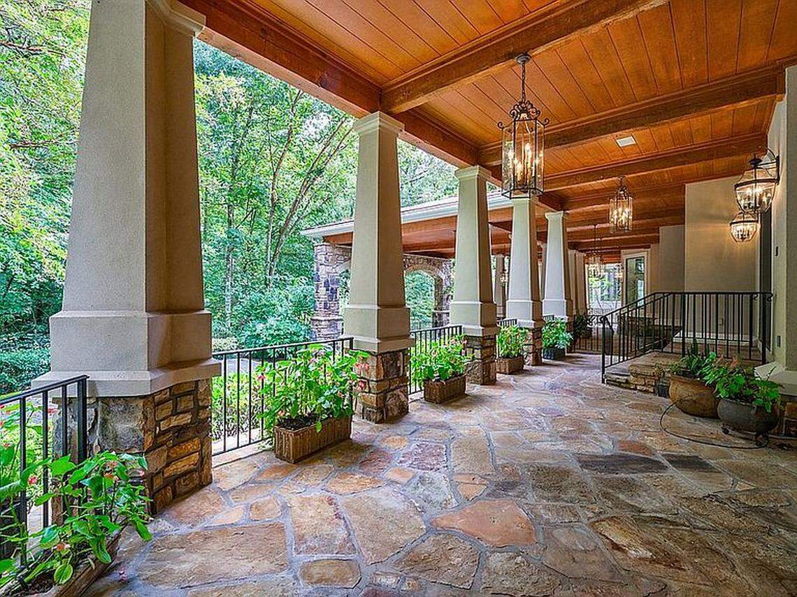 Jeff Foxworthy’s old mansion includes a terrace with oversize lanterns and reclaimed wood beams from the Hershey Factory in Pennsylvania.