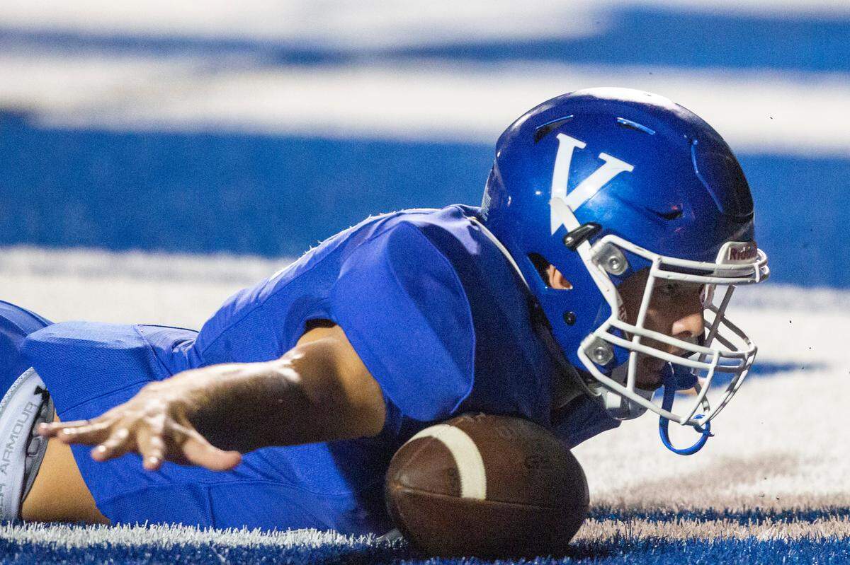 Vancleave’s Layton Eder (12) celebrates with his arms outstretched after scoring a touchdown during a game against Moss Point at Vancleave Football Stadium in Vancleave on Friday, Sept. 9, 2022.