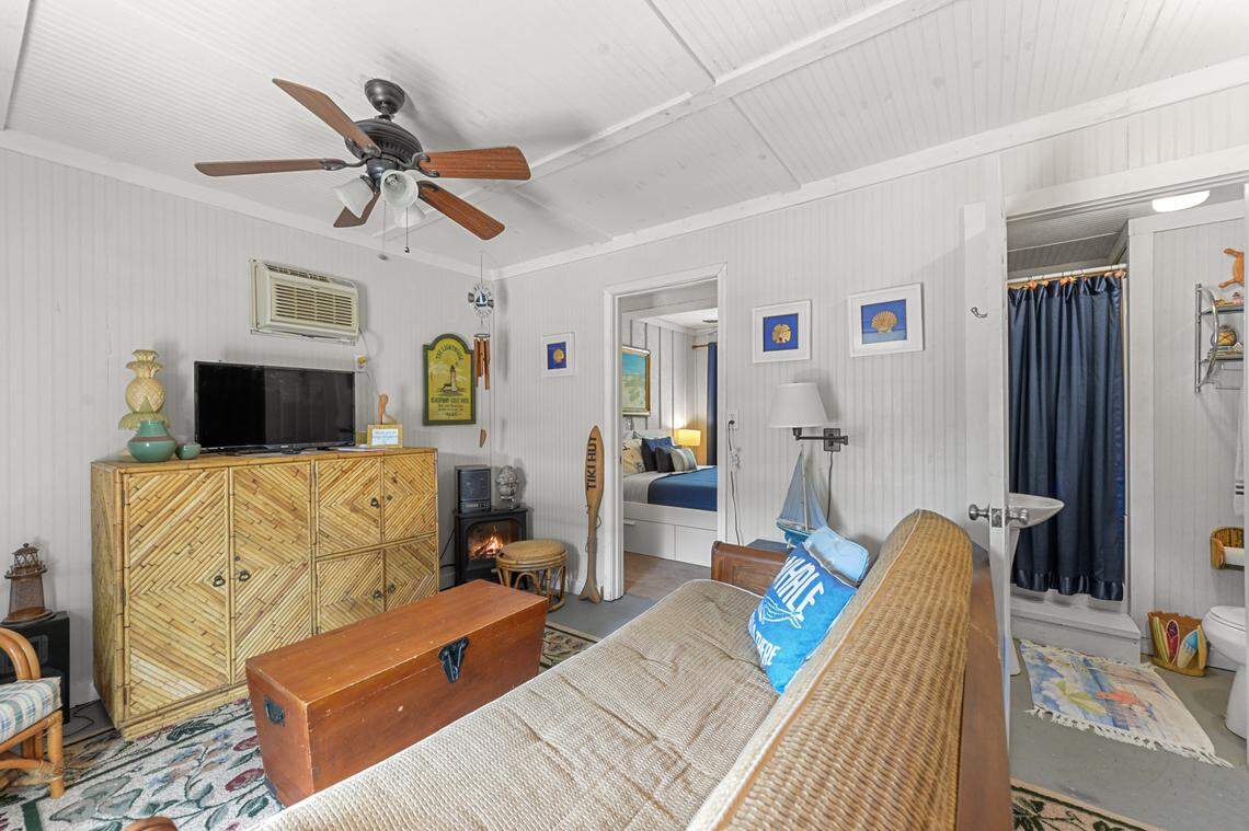 A futon folds out into a bed in the living room of the downstairs apartment on the Breezy Porches property in Waveland.