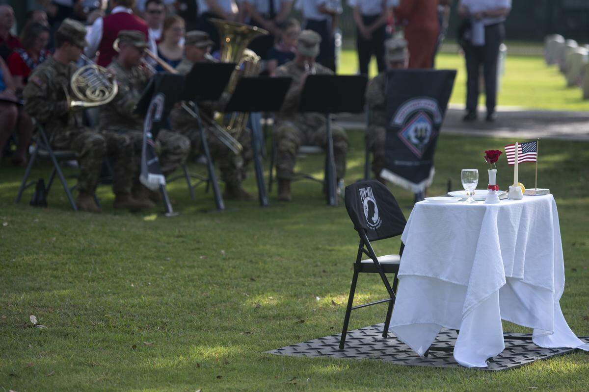 A table representing prisoners of war and those killed in action during a Memorial Day ceremony at Biloxi National Cemetery in Biloxi on Monday, May 26, 2025.