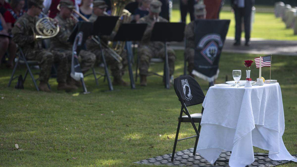 A table representing prisoners of war and those killed in action during a Memorial Day ceremony at Biloxi National Cemetery in Biloxi on Monday, May 26, 2025.