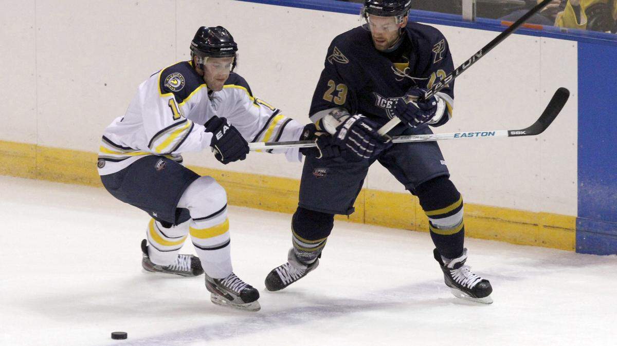 Trent Bonnett, left, of the Mississippi Surge fights Ryan Salvis of Pensacola for the puck at the Mississippi Coast Coliseum in Biloxi in 2012. A group is hoping to bring professional hockey back to the Coast.