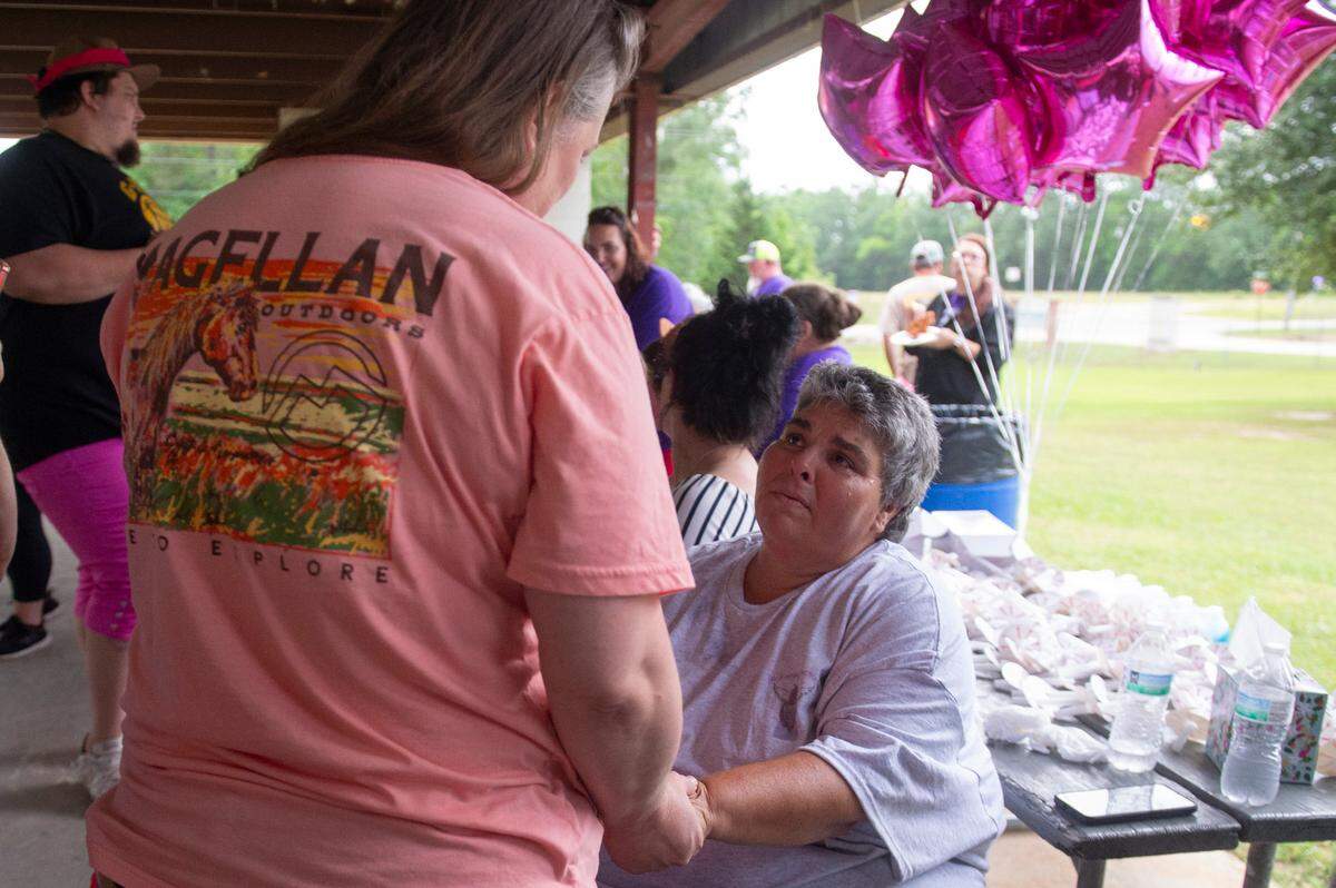 Vickie Wedgeworth Hutcherson, the mother of Gracelynn Vick, greets family and community members during a candlelight vigil for Gracelynn at Saucier Park on Tuesday, April 22, 2025.