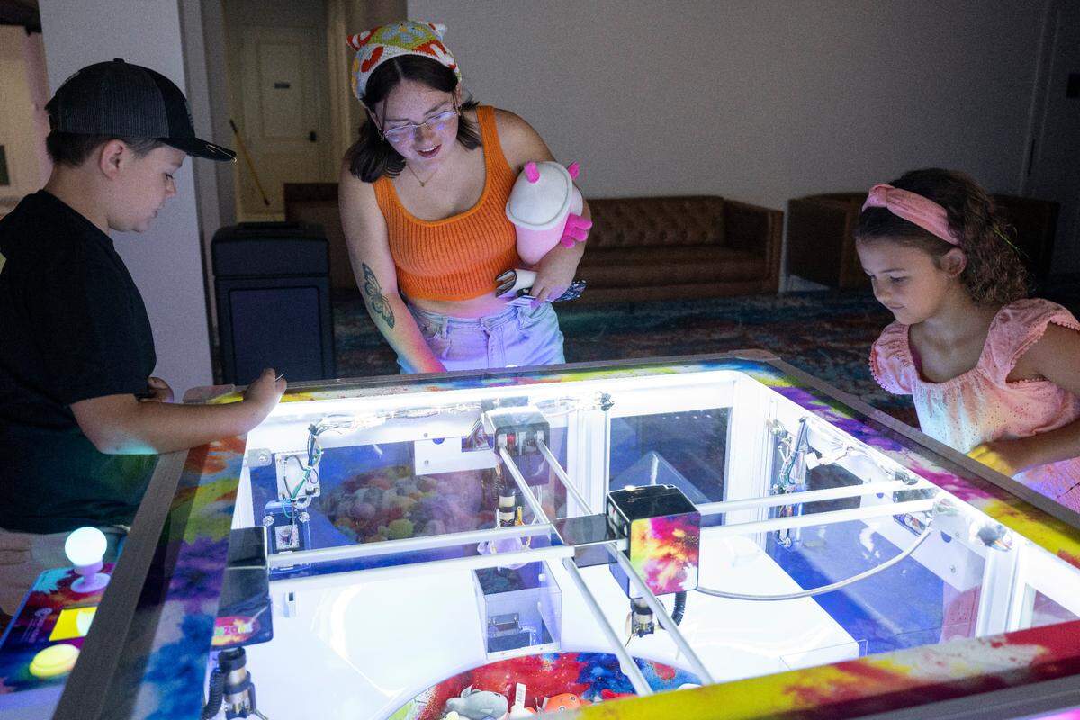 Visitors play claw games at Hippie Fish at Centennial Plaza in Gulfport on Thursday, June 26, 2025.