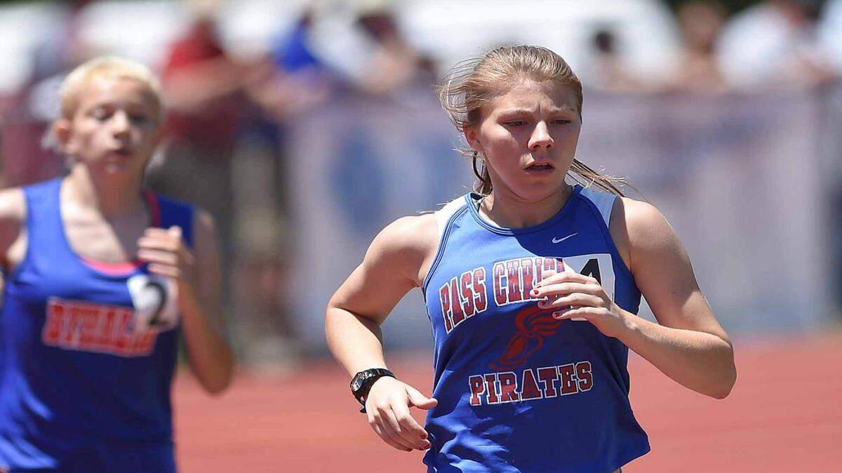 CHRIS TODD/SPECIAL TO THE SUN HERALD 
 Pass Christian's Regen McGee leads the field of the Class 2A 1600 meter run on Friday, May 6, 2016, at the MHSAA Class 2A-4A-6A State Track Championships at Pearl High School in Pearl, Miss.