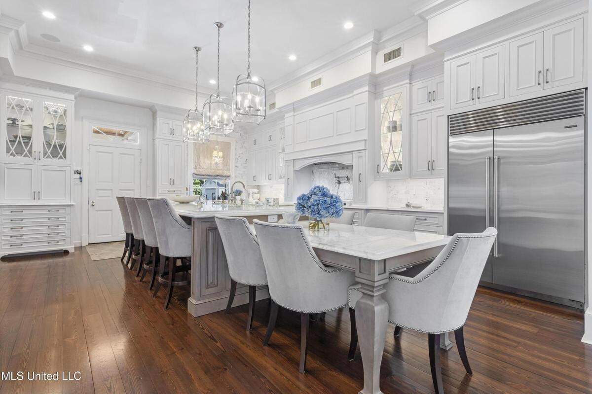 The kitchen in a Gulfport mansion on the market includes a Wolf gas range, sub-zero appliances and an island that seats nine.
