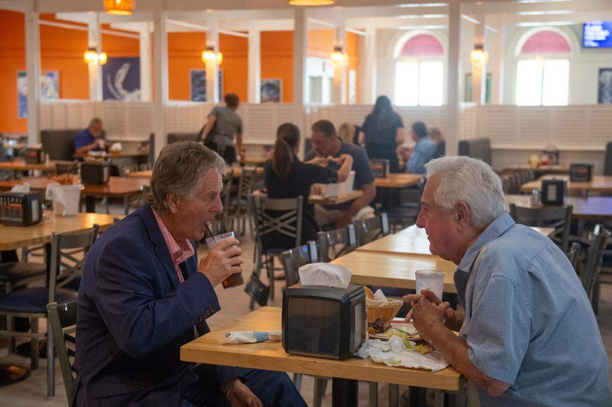 Biloxi mayor Andrew “FoFo” Gilich, left, dines at Boomtown Casino’s new buffet, the Biloxi Bay Buffet, on Thursday, April 3, 2025.