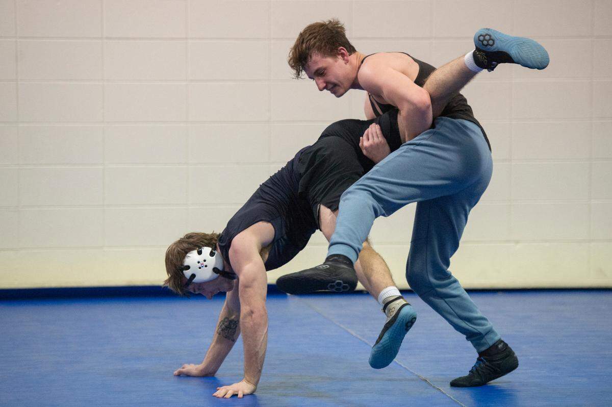 Gabe Beeman and Jared Barr practice wrestling moves on each other during Ocean Springs’ high school wrestling practice at E.H. Keys Alternative Education Center on Thursday, Feb. 8, 2024.