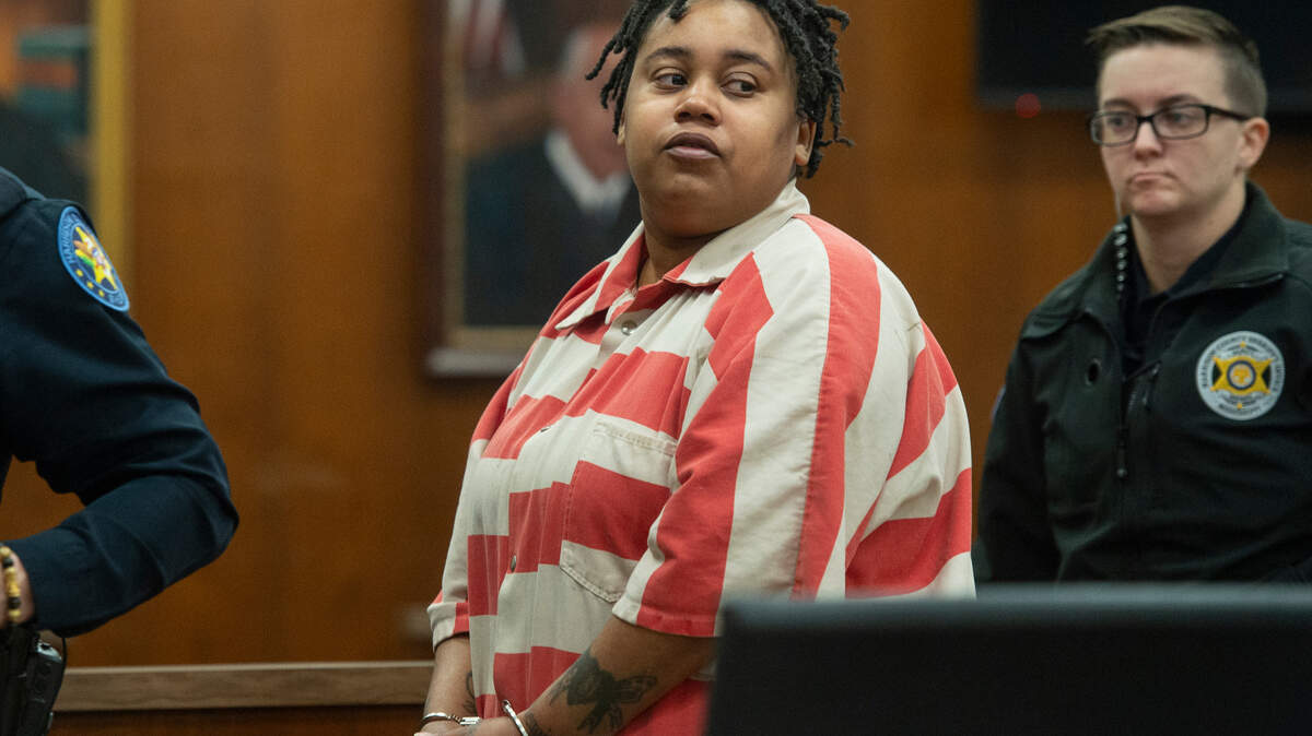 Jahcoriya Annette-Yashon May walks out of the courtroom Thursday after pleading guilty in Harrison County Circuit Court. May pleaded guilty to one charge of domestic violence-aggravated assault and one charge of aggravated assault.