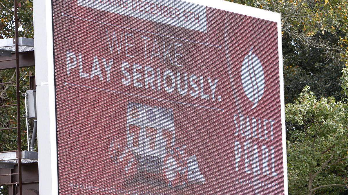 TIM ISBELL/SUN HERALD 
 A sign tells future customers that the Scarlet Pearl Casino will open in December 2015.