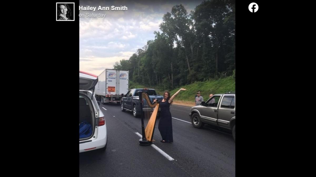 Musician Hailey Smith played her harp in the middle of the highway when a car accident brought traffic to a standstill on I-85 in Atlanta, photos show.