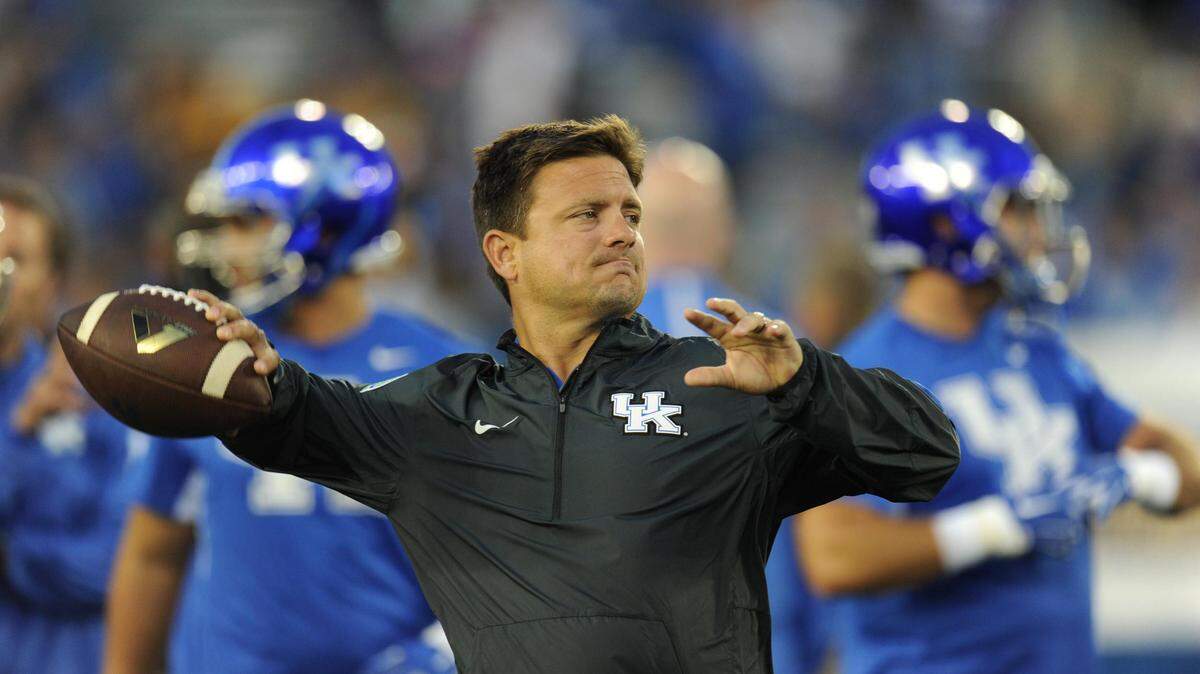 UK offensive coordinator Shannon Dawson throws prior to the University of Kentucky-Missouri football game at Commonwealth Stadium in Lexington, Ky., on Saturday, September 26, 2015. Photo by Ken Weaver