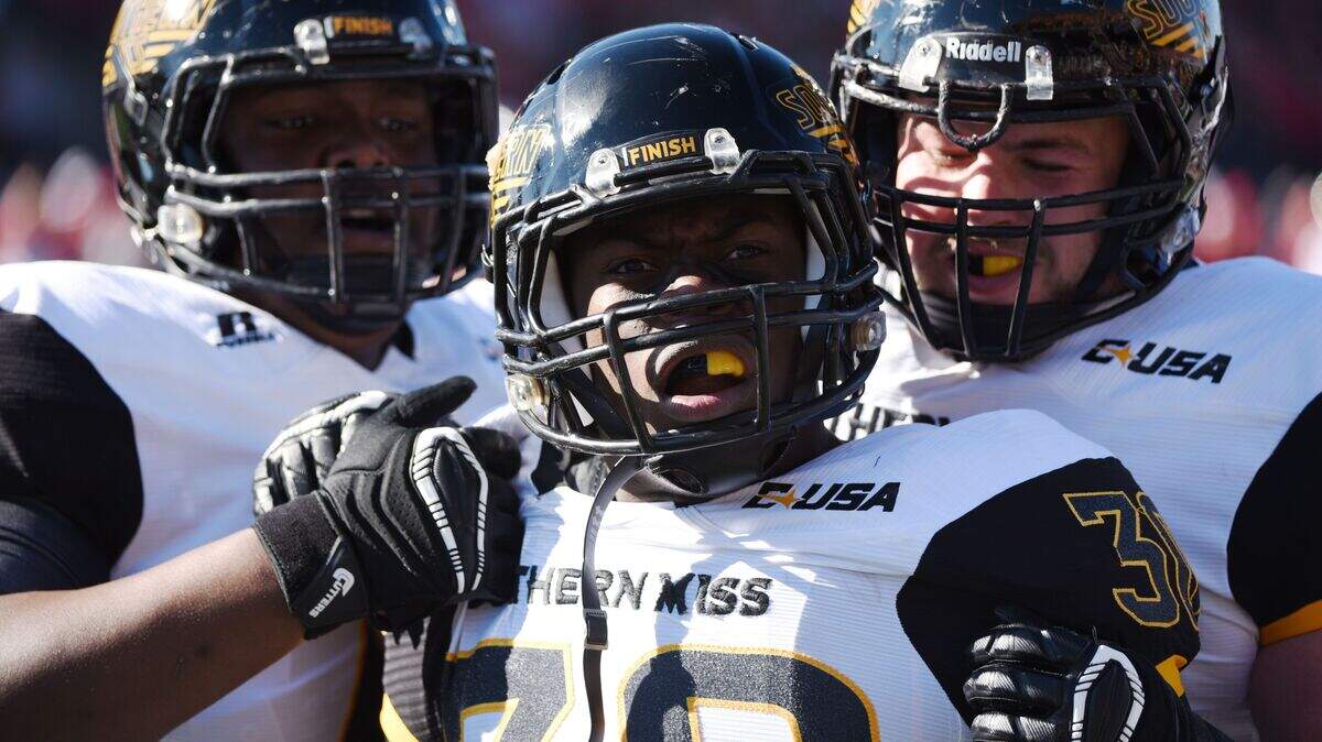 Southern Mississipp running back Jalen Richard (30) celebrates a touchdown in the first half of a NCAA college football Conference USA championship game on Saturday, Dec. 5, 2015, at L.T. Smith Stadium in Bowling Green, Ky. (AP Photo/Michael Noble Jr.)