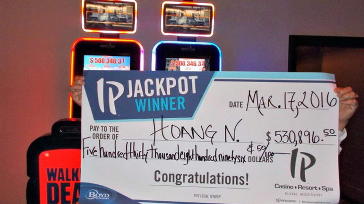 IP CASINO RESORT 
 Hoang N., no last name provided, obscures his face while holding up his check for $530,896.50 after winning the jackpot at IP Casino Resort Friday. The won on the bonus round of The Walking Dead progressive penny slot.