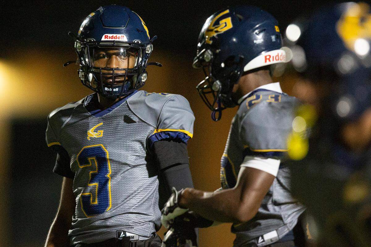 Gautier quarterback Trey Irving and running back Latrell Pogue prepare for the snap during a 5A playoff game between Gautier and Natchez at Gautier High School on Friday, Nov. 15, 2024.