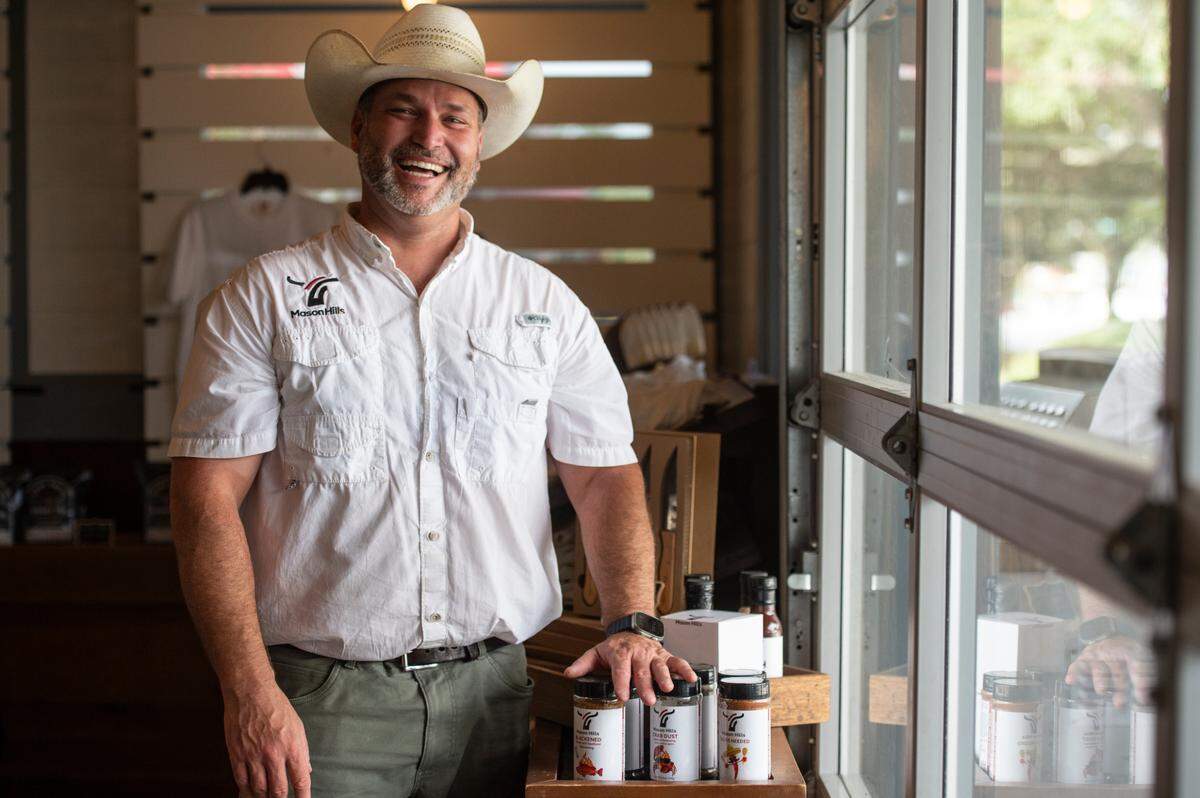 Joseph Mason, owner of 4-Bulls Farm To Table, poses for a portrait at the butcher shop’s new location in Ocean Springs on Thursday, Oct. 31, 2024.