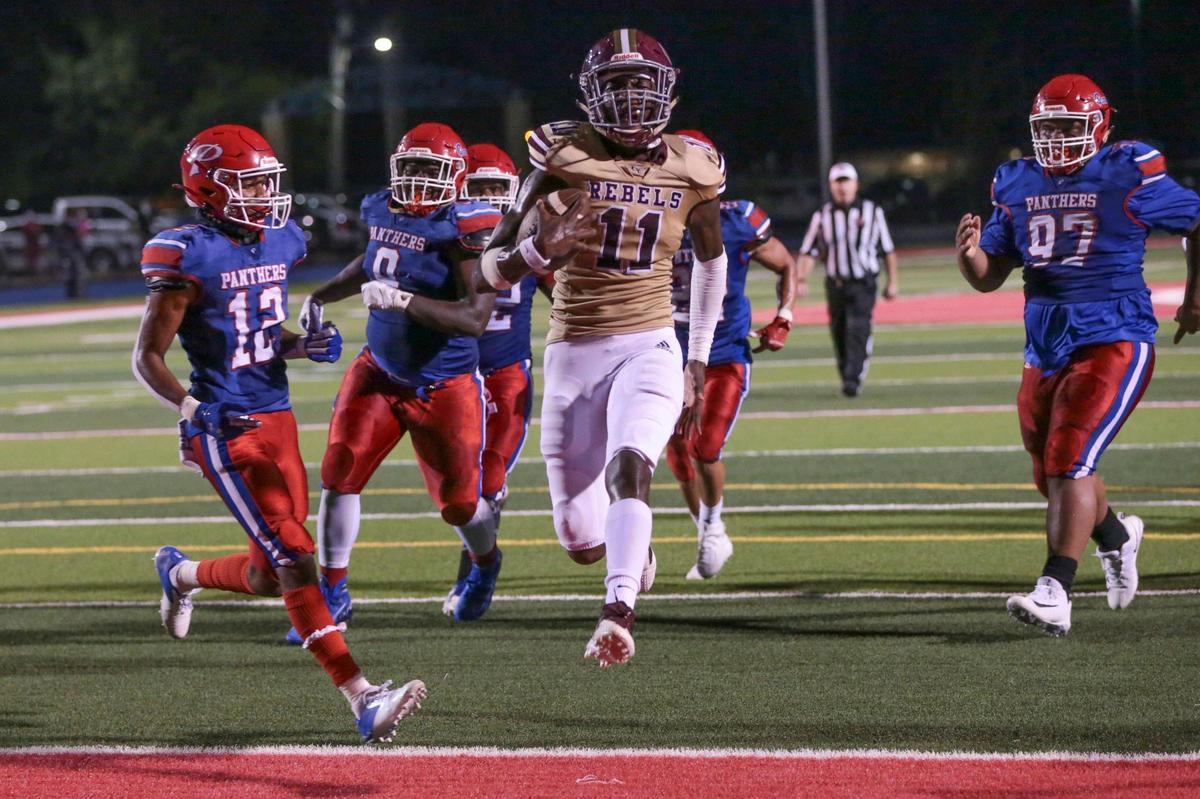 George County quarterback MJ Daniels (11) scores his second touchdown of the night during the game between George County and Pascagoula in Pascagoula Friday.