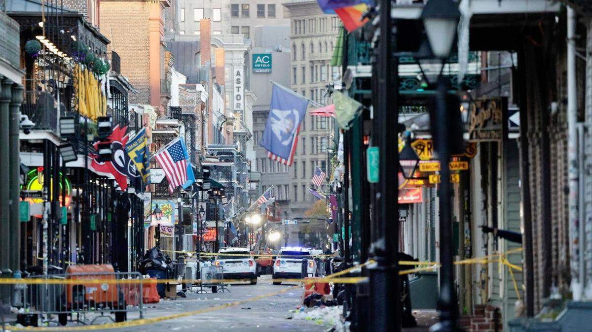 Bourbon Street in New Orleans sits empty Wednesday, Jan. 1, 2025, after a morning attack claimed the lives of at least 15 partygoers.