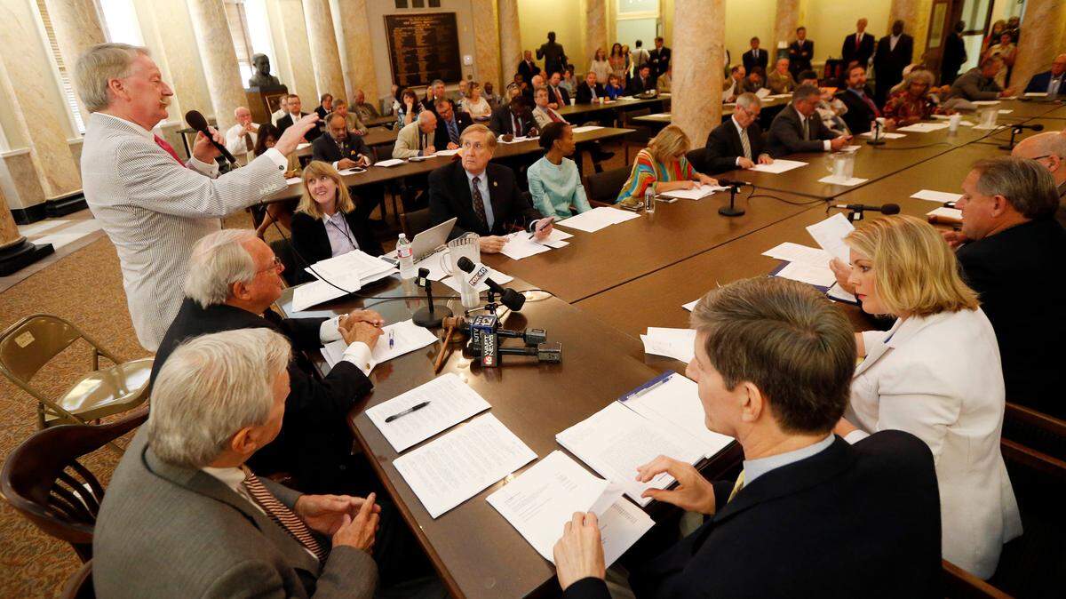 Members of the House Appropriations Committee listen to House Ways and Means Committee Chairman Jeff Smith, R-Columbus, left, answer questions about a 2018 bill. The amount of money appropriated to pay for state government for the last fiscal year – 2018 – is $260 million less than what was spent in fiscal year 2008 in inflationary dollars.