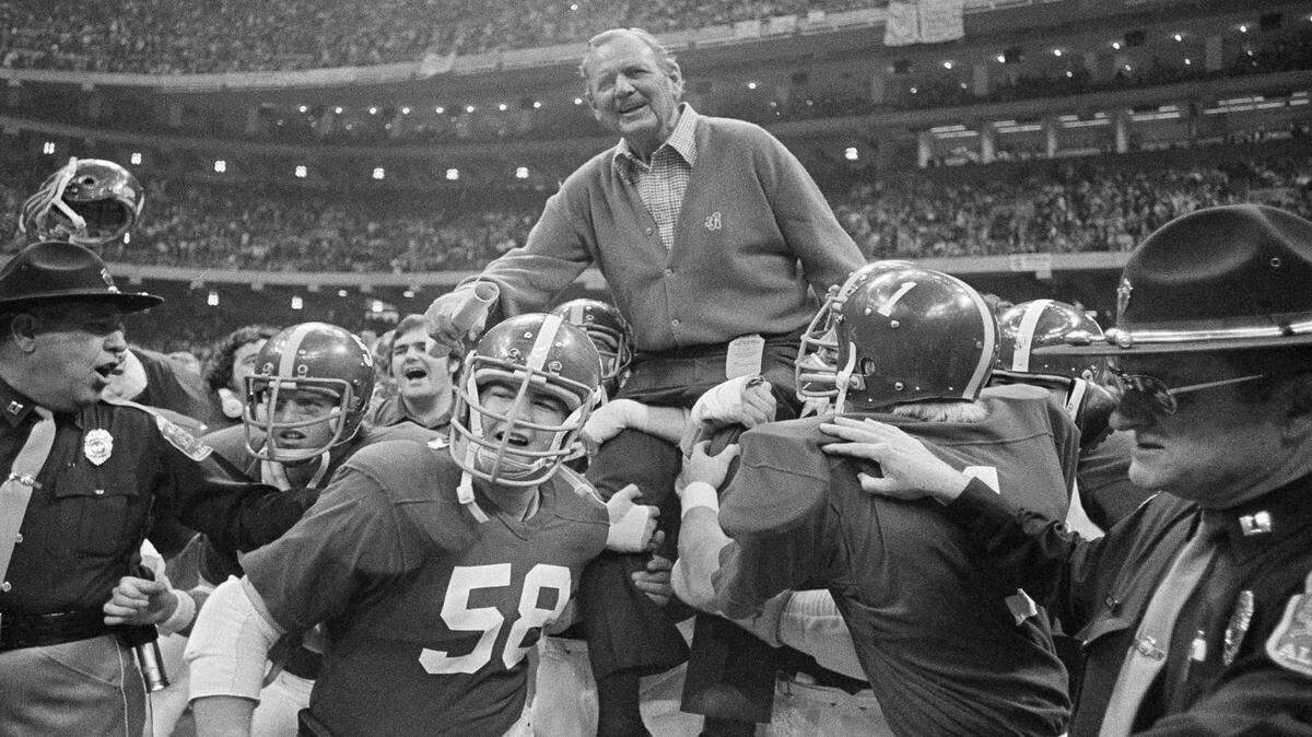 Coach Bear Bryant of Alabama is carried off the field Wednesday night after his team defeated Penn State 13-6 in the 42nd annual Sugar Bowl in New Orleans, Jan. 1, 1976. (AP Photo)
