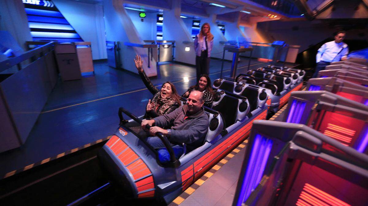 Riders cheer after riding the updated Hyperspace Mountain at Disneyland during the media preview of Star Wars Season of The Force on Nov. 12, 2015 in Anaheim, Calif. (Allen J. Schaben/Los Angeles Times/TNS)