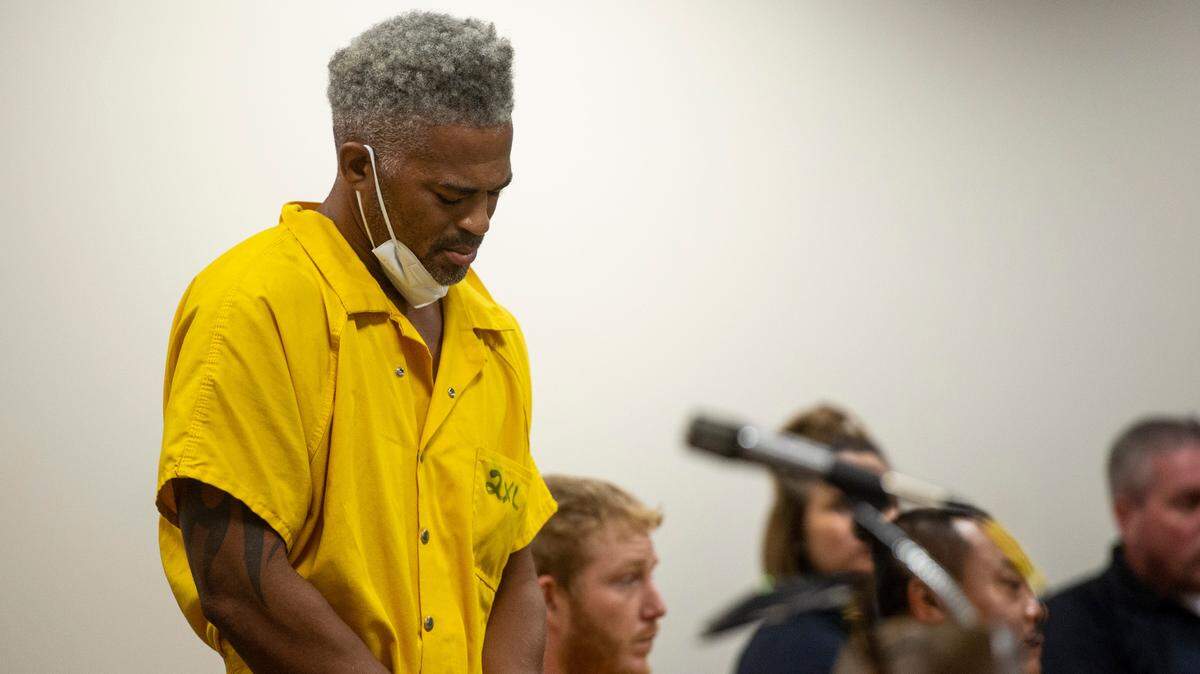 Vinet Moore, accused of attempted murder, looks down as he stands in front of the judge at Jackson County Courts during his hearing on Monday, Sept. 13, 2021.
