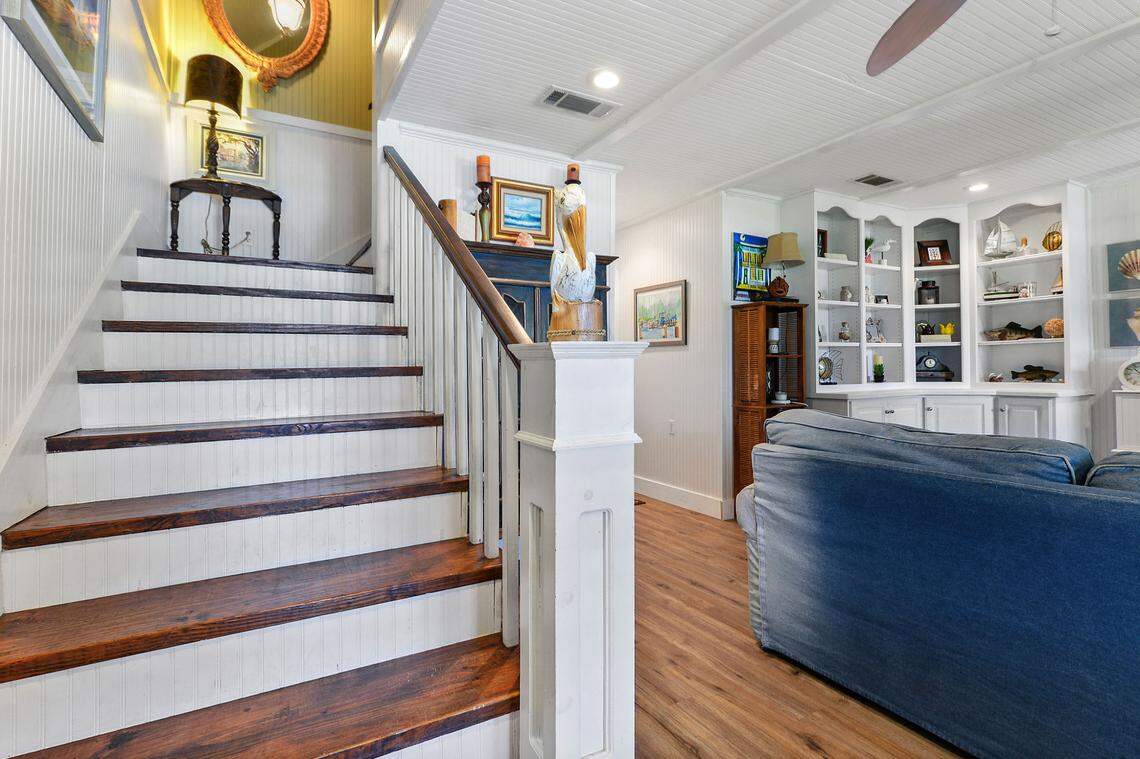 The stairs at Breezy Porches feature a pelican finial and wood-pegged steps.